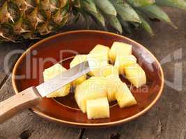 Sweet organic pineapple on wood