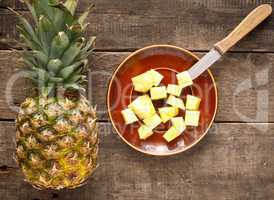 Sweet organic pineapple on wood