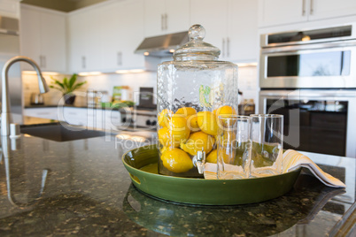 Abstract of Interior Kitchen Counter with Lemon Filled Pitcher a