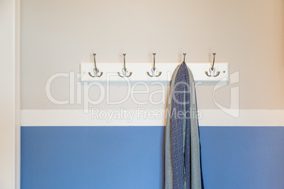 Wall in House with Scarf Hanging on Coat Rack Hooks Abstract