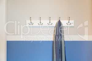 Wall in House with Scarf Hanging on Coat Rack Hooks Abstract