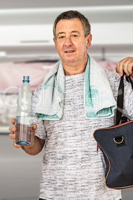 Man with water bottle and sports bag