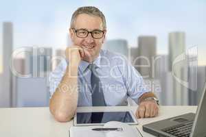 Businessman is sitting at the desk
