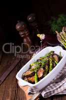 Eggplant casserole with green asparagus