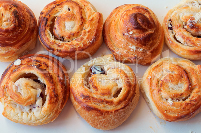 buns of puff pastry, curly buns with cheese, cheese baked puff pastry