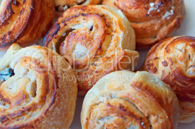 buns of puff pastry, curly buns with cheese, cheese baked puff pastry