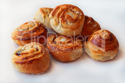 buns of puff pastry, curly buns with cheese, cheese baked puff pastry