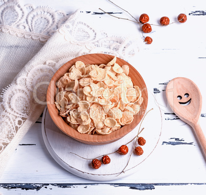 cornflakes in a wooden bowl