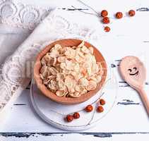 cornflakes in a wooden bowl