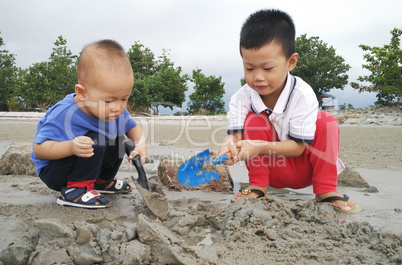 Children playing sand at beach