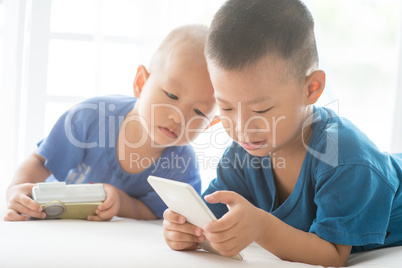 Children addicted to smart phone.