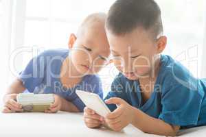 Children addicted to smart phone.