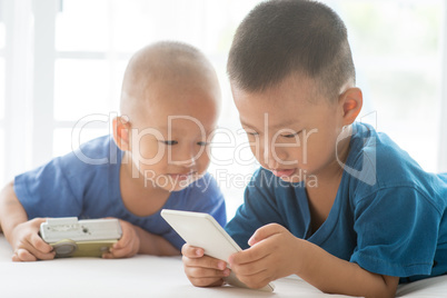 Young children addicted to smart phone.