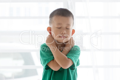 Playful boy pulling ears