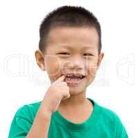 Asian child pointing teeth
