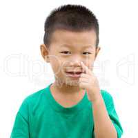 Asian child pointing nose