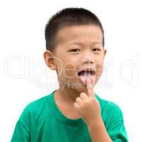 Asian child pointing tongue