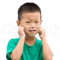 Asian child pointing ears
