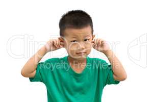Asian boy covered his ears