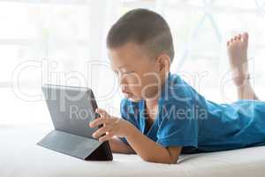 Child addicted to tablet.