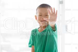Playful boy showing high five
