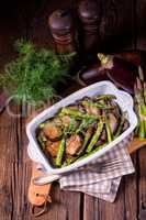 Eggplant casserole with green asparagus