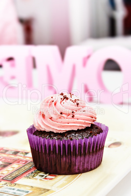 Chocolate and strawberry cream cupcake.