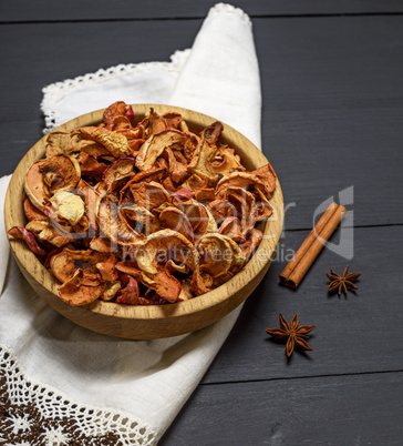 Dried apple slices in an wooden plate