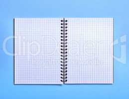 open blank notebook in a box on a blue background