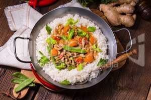 wok pan with meat strips and vegetables