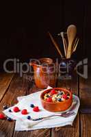 rustic muesli breakfast with forest fruits