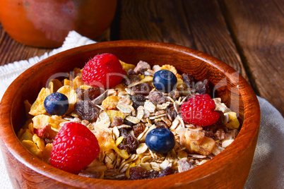 rustic muesli breakfast with forest fruits