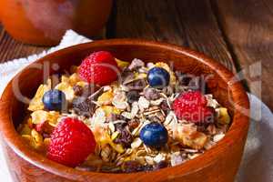 rustic muesli breakfast with forest fruits