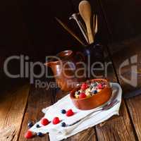 rustic muesli breakfast with forest fruits