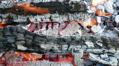 Firewood with hot red charcoal