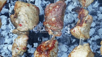 Baking meat on rotating metal rods