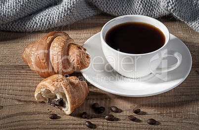 Black coffee with croissants