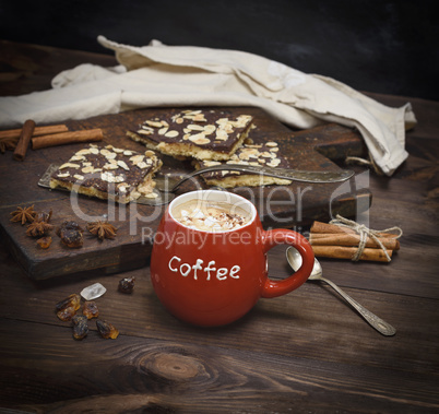 black coffee with marshmallow in a red ceramic mug