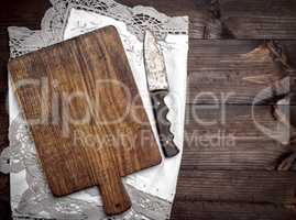 empty old brown wooden cutting board with handle