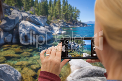 Woman Taking A Beautiful Lake Picture with Her Smart Phone