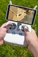 Hands Holding Drone Quadcopter Controller With Construction Hous