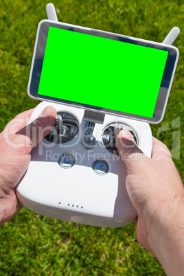 Hands Holding Drone Quadcopter Controller With Blank Green Scree