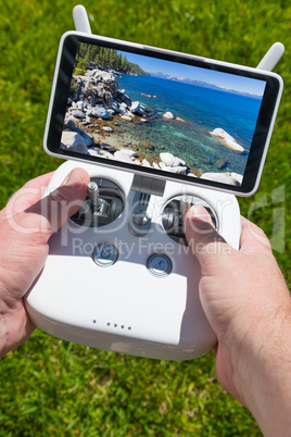Hands Holding Drone Quadcopter Controller With Beautiful Lake Vi