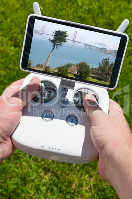 Hands Holding Drone Quadcopter Controller With Golden Gate Bridg