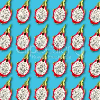 Pitaya fruit slices pattern on vibrant turquoise background