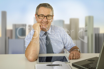Businessman is sitting at the desk