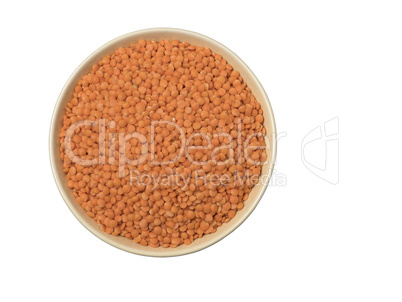Bowl of red split lentil isolated on white background.
