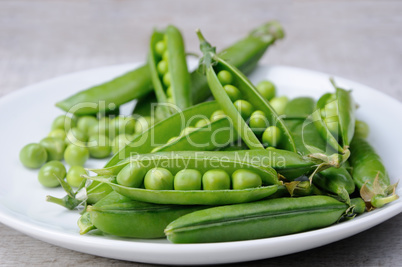 Pods of fresh green peas