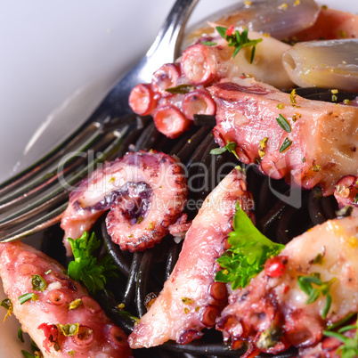octopus with black spaghetti and garlic sauce