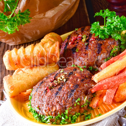 grilled bullets with croquettes and vegetables